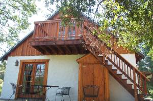 Back porch showing staircase to dormer.